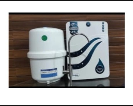 Under-sink RO purifier with a white storage tank and chrome faucet